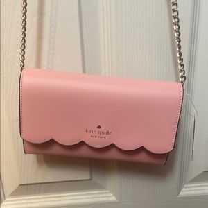 Kate Spade wallet on chain, in the color donut pink